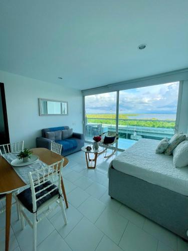 Ένα ή περισσότερα κρεβάτια σε δωμάτιο στο Apartamento en Cartagena cerca al hotel las Américas