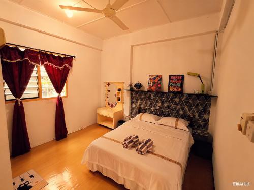 Ένα ή περισσότερα κρεβάτια σε δωμάτιο στο 玖月舒苑