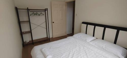 Postel nebo postele na pokoji v ubytování IJM 85 Terrace Sandakan