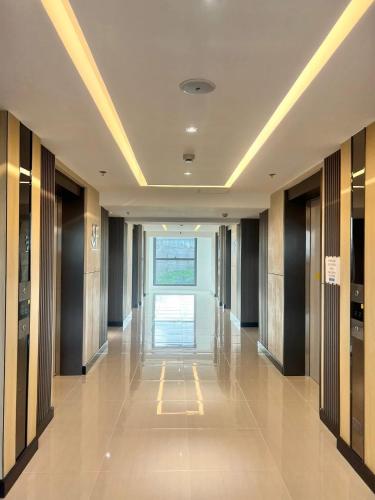 a hallway of a building with a long corridor at J Tower Residences in Bakilid