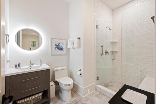 a bathroom with a toilet and a sink and a shower at DP2931: 2931 Deer Point in Seabrook Island