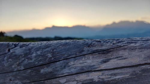 a view of the sun setting over the mountains at Casa dei Moch in Belluno