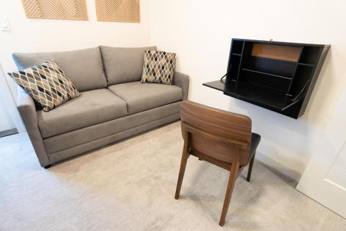 a living room with a couch and a chair at Seattle Townhouse with Rooftop Deck in Ballard in Seattle