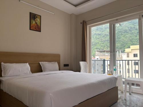 Ένα ή περισσότερα κρεβάτια σε δωμάτιο στο Hotel Abline Rishikesh