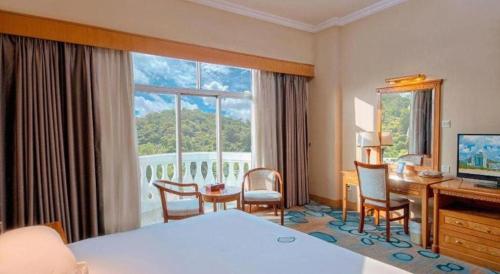 Postel nebo postele na pokoji v ubytování Zhuhai Dehan Hotel