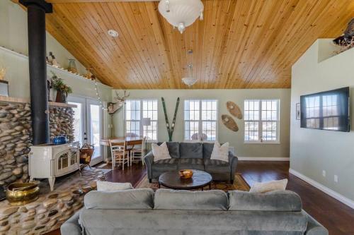 a living room with a couch and a fireplace at Lone Eagle Haven home in Mesa