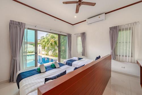 Ένα ή περισσότερα κρεβάτια σε δωμάτιο στο Orchid Pool Villa Rawai