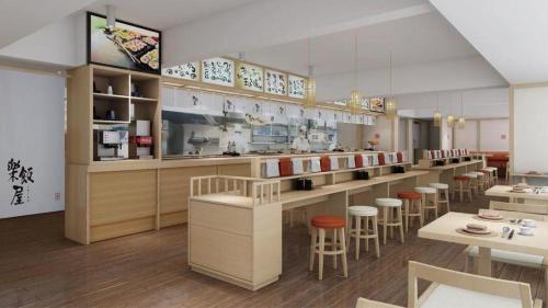 a restaurant with a bar with stools and tables at M Hotel Shenzhen Nanshan in Shenzhen
