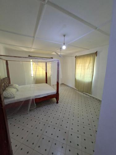 Ένα ή περισσότερα κρεβάτια σε δωμάτιο στο Guguski Homes