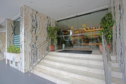a stairway leading to a building with plants at Hotel Malaysia in George Town