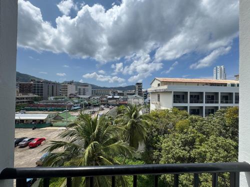 a view of a city from a balcony at Days Inn by Wyndham Patong Beach in Patong Beach