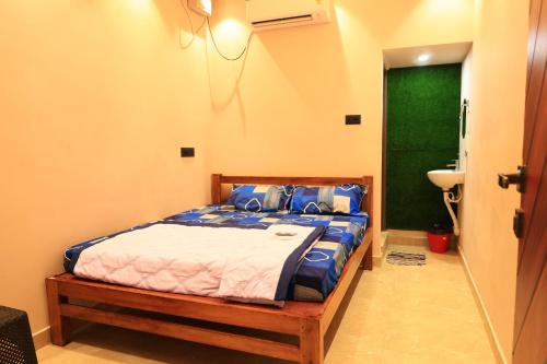 Postel nebo postele na pokoji v ubytování Le Sunrise Residency