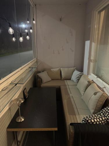 a small living room with a couch and a table at Lägenhet Kaskö in Kaskö