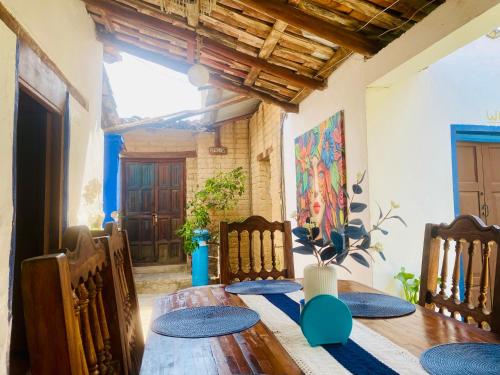a dining room with a wooden table and chairs at Casa Cristal in Chiapa de Corzo