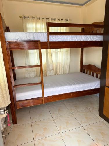 a couple of bunk beds in a room at Roseville Home Stay and Moroccan Spa and Wellness in Baranghauon