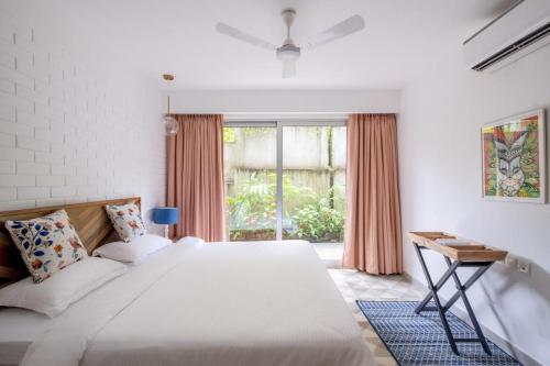 Ένα ή περισσότερα κρεβάτια σε δωμάτιο στο Cosmos Oasis by Da Alohas, Luxury 2BHK at Candolim