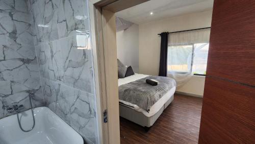 Postel nebo postele na pokoji v ubytování Casa Línda Guest House
