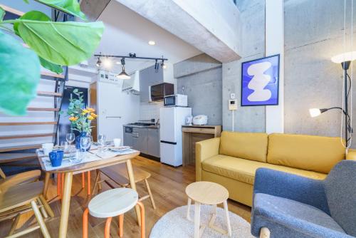 a living room with a couch and a table at Central Nagoya! 15 min from Sta 2 Beds Max7 Family in Nagoya