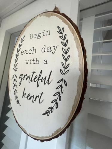 a sign that says begin each day with a grateful heart at Town House Ideal for working professionals in Stoke on Trent