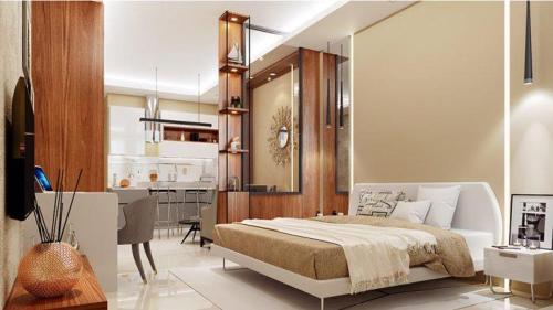 een slaapkamer met een bed en een woonkamer bij Stay Luxurious in Jaipur