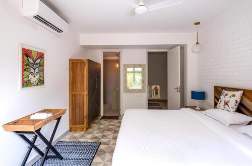 Ένα ή περισσότερα κρεβάτια σε δωμάτιο στο Cosmos Oasis by Da Alohas, Luxury 2BHK at Candolim