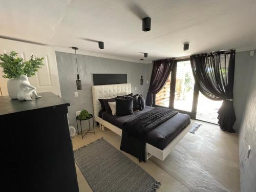 Postel nebo postele na pokoji v ubytování Trogon Flat