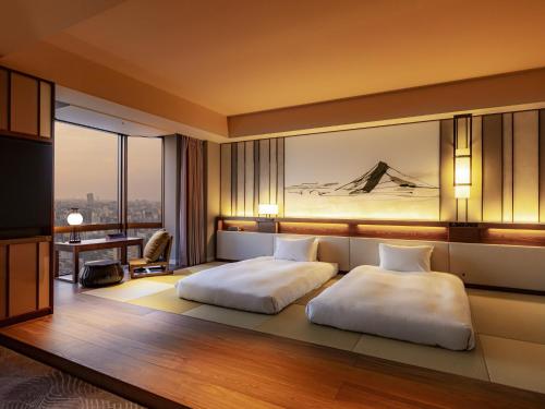a hotel room with a bed and a desk at Asakusa View Hotel in Tokyo