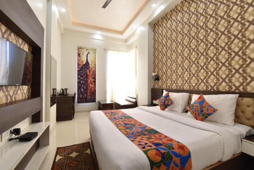 Voodi või voodid majutusasutuse Indra Palace toas