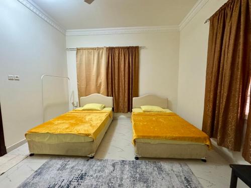 Postel nebo postele na pokoji v ubytování Beachside Room in Muscat