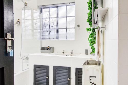 a bathroom with a sink and a mirror at Spacious Valkyrie One-bedroom in Centurion