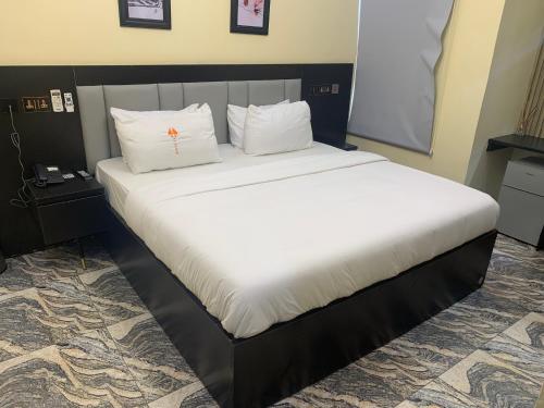 Cama ou camas em um quarto em P1 Place