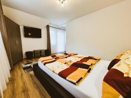 En eller flere senge i et værelse på Casa Sonne