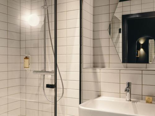 a bathroom with a shower and a sink at Mercure Marseille Canebière Vieux-Port in Marseille