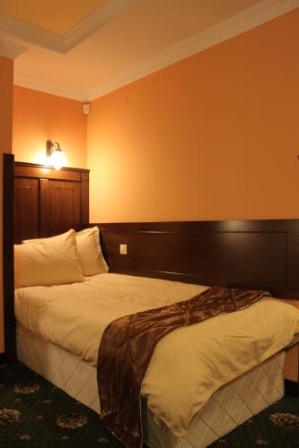 a hotel room with two beds in a room at Stoichkovata Kashta Koprivshtitsa in Koprivshtitsa