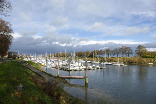 a group of boats docked in a harbor at Semi-detached house, Rieux in Rieux