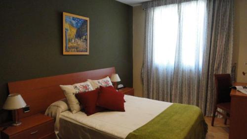 מיטה או מיטות בחדר ב-Hotel Montero