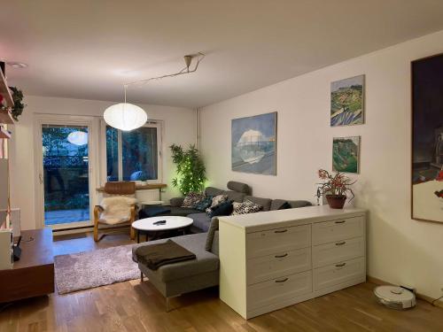 a living room with a couch and a table at Spacious Apartment in Sodermalm in Stockholm