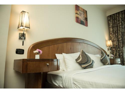 Katil atau katil-katil dalam bilik di Cherry Maryski Hotel