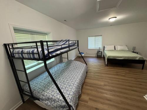 a room with two bunk beds and a window at Hidden gem at the lake 4 bedrooms in Moneta