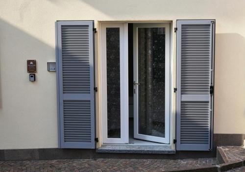 an open door of a building with a window at Al Castello in Calolziocorte