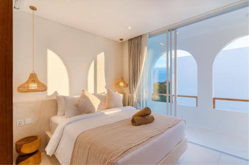 Ένα ή περισσότερα κρεβάτια σε δωμάτιο στο Villa Valli 5, Luxury Mediterranean Villa Bingin