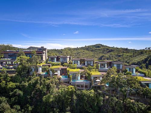 a group of houses on a hill with trees at V Villas Phuket - MGallery Collection in Panwa Beach