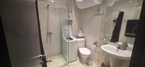 a bathroom with a shower and a toilet and a sink at Studio F210 - Bulharsko in Aheloy