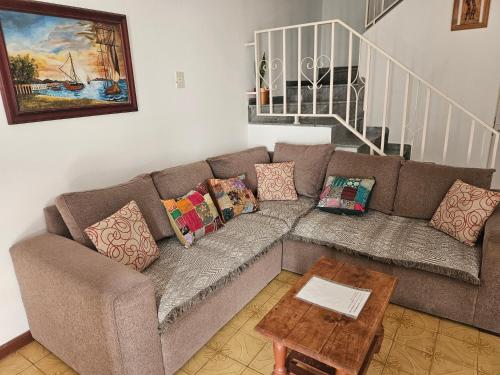 a living room with a couch and a table at Alquiler temporario en zona centrica de San Nicolas De Los Arroyos in San Nicolás de los Arroyos