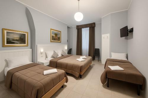 Katil atau katil-katil dalam bilik di Hotel Aurelia Milano Centrale