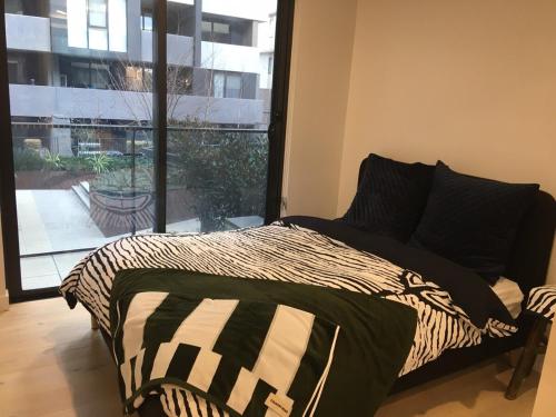 Ένα ή περισσότερα κρεβάτια σε δωμάτιο στο Mulberry Life Apartments