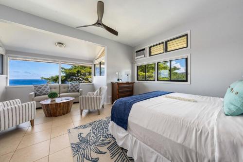 a bedroom with a bed and a living room at Kapalua Ridge Villas 1723 · KRV 1723 Luxury Ocean View + Free Lu in Kahana
