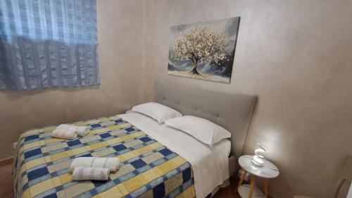 Ένα ή περισσότερα κρεβάτια σε δωμάτιο στο L' albero di Giada