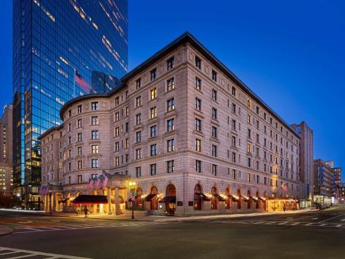 a large building on a city street at night at Fairmont Copley Plaza in Boston
