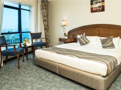 Katil atau katil-katil dalam bilik di Cherry Maryski Hotel